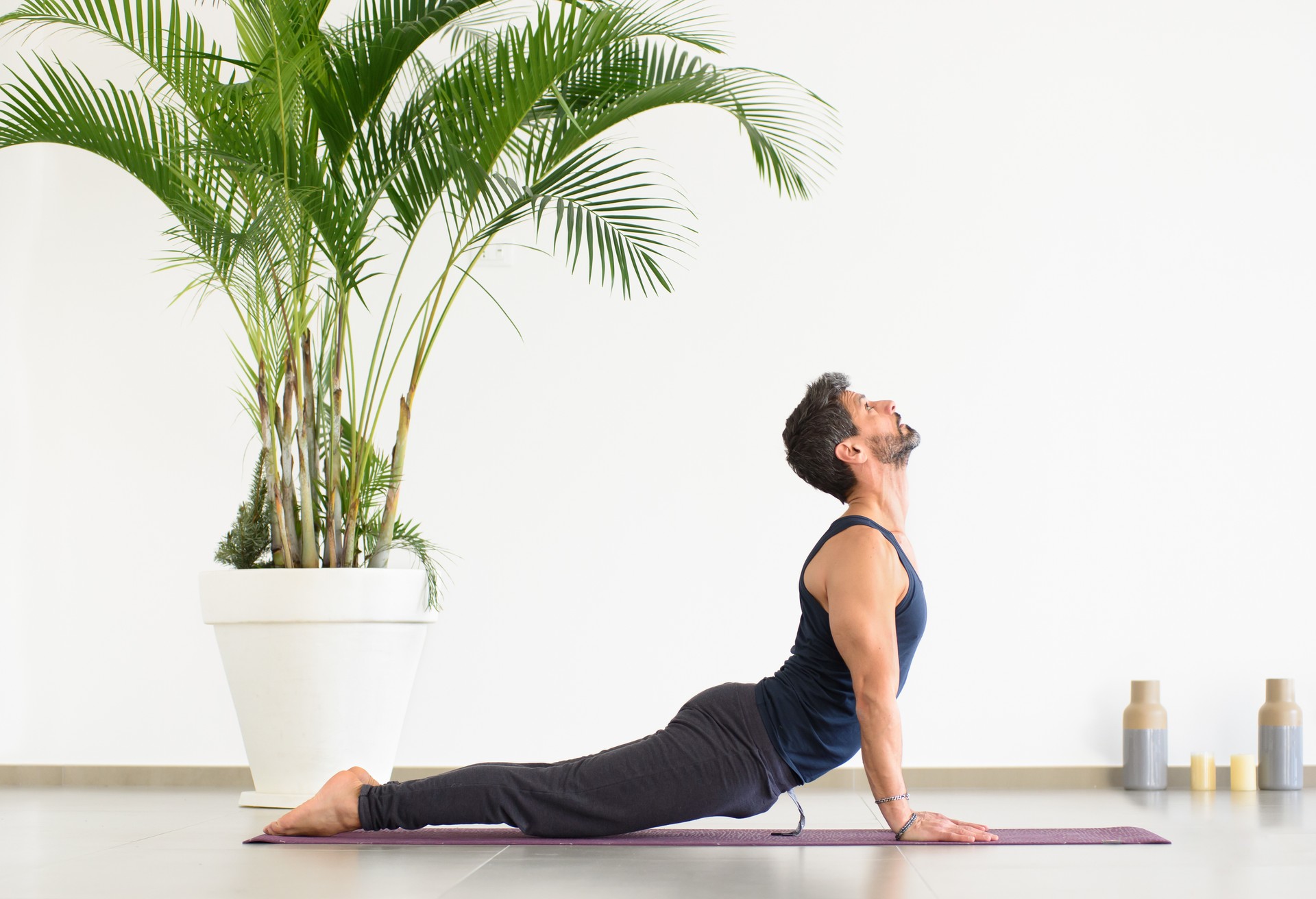 Side View Of Man in Yoga poses downward dog